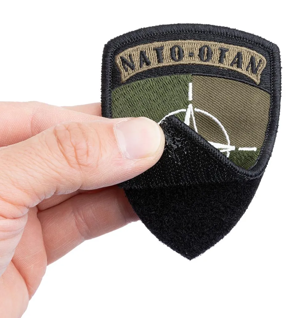 Merkillinen Tunnukset ^ NATO / OTAN merkki